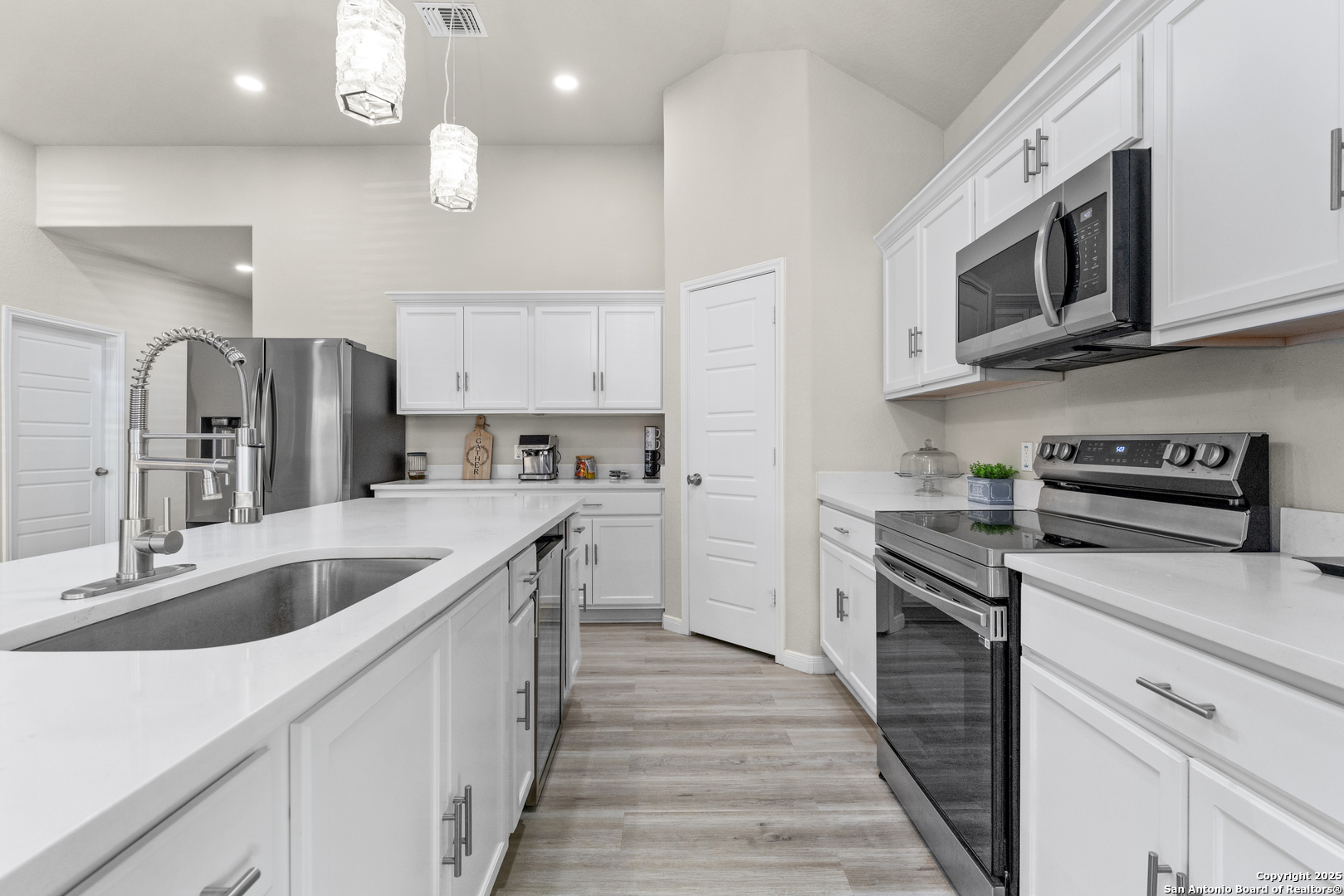 16851 Griffin Road, Unit 2 Atascosa, TX 78002 - Photo 18 of 37 a kitchen with stainless steel appliances granite countertop a sink and a stove