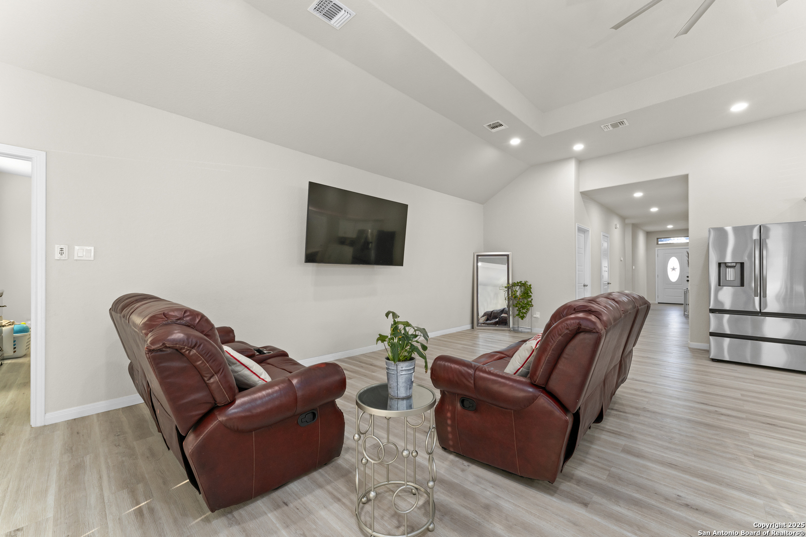 16851 Griffin Road, Unit 2 Atascosa, TX 78002 - Photo 22 of 37 a living room with furniture a flat screen tv and wooden floor