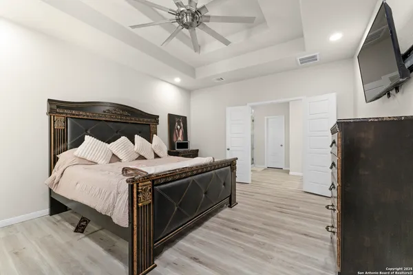 a bed room with a bed and a television