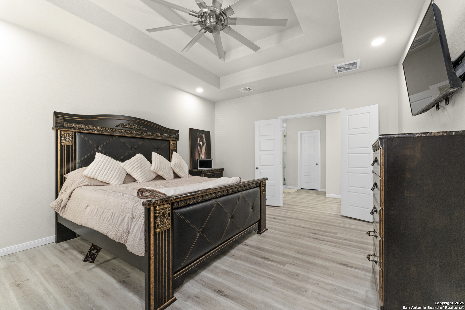 16851 Griffin Road, Unit 2 Atascosa, TX 78002 - Photo 23 of 37 a bed room with a bed and a television