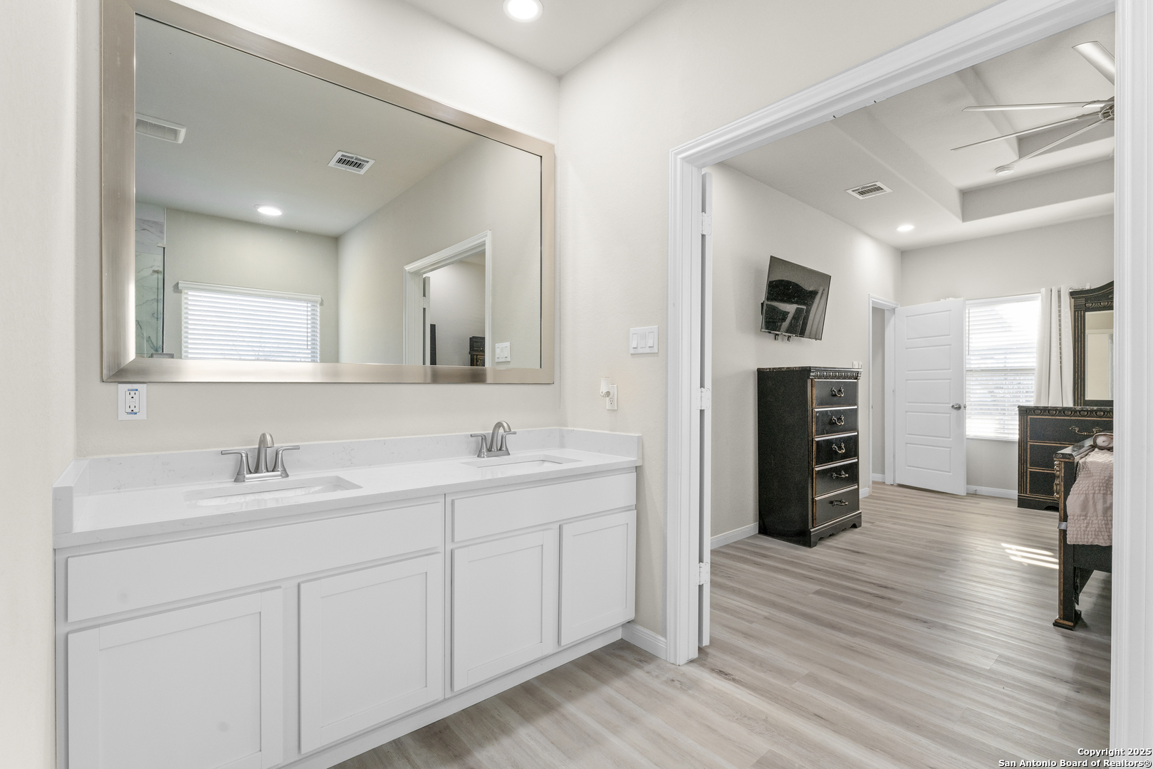 16851 Griffin Road, Unit 2 Atascosa, TX 78002 - Photo 27 of 37 a spacious bathroom with a double vanity sink and a mirror