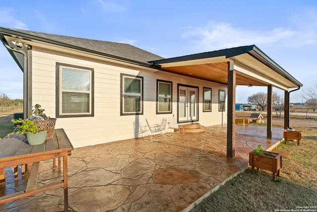 a view of a swimming pool with a porch