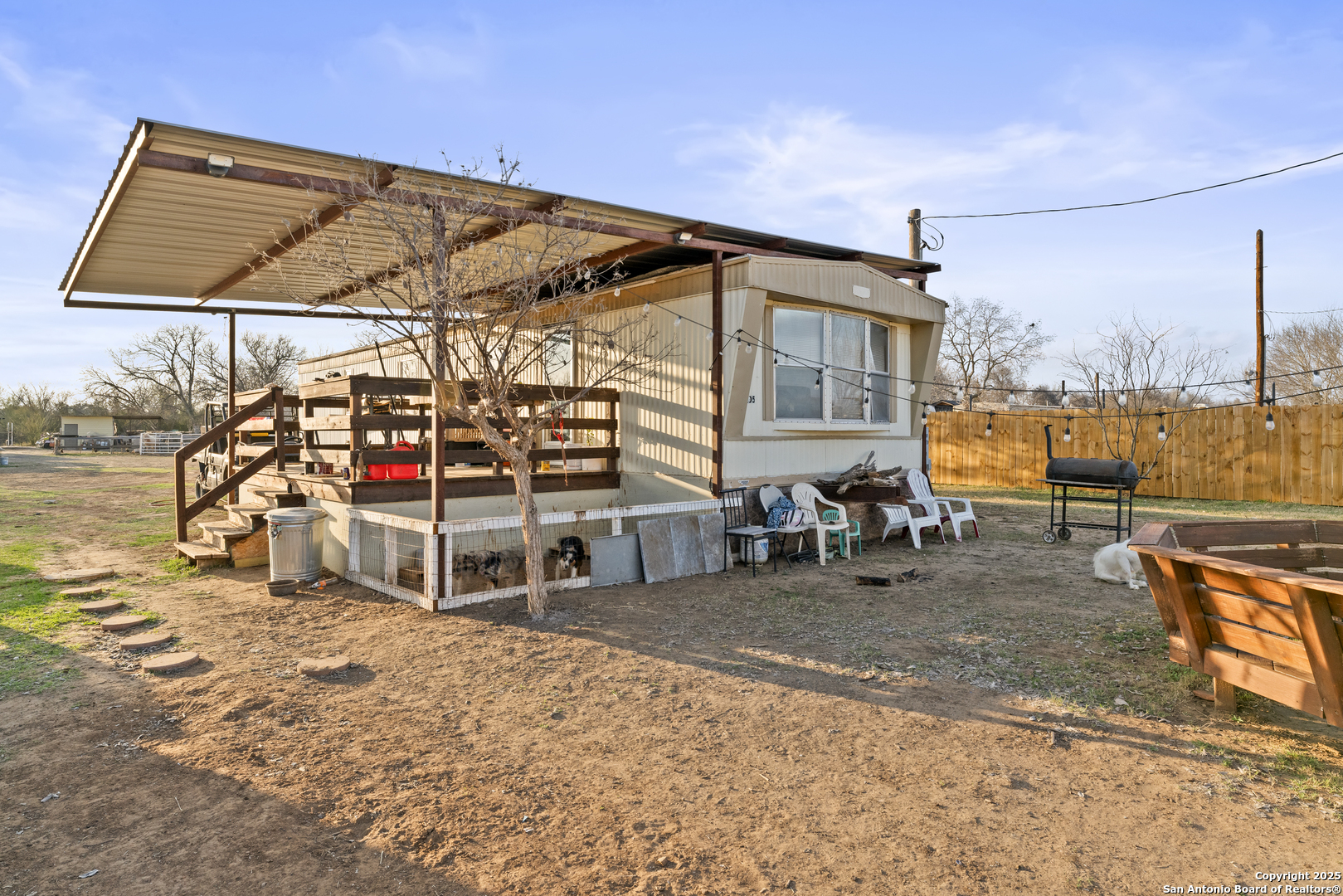 16851 Griffin Road, Unit 2 Atascosa, TX 78002 - Photo 32 of 37 a view of a chairs and table in the patio