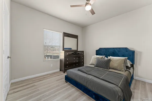 a bathroom with a sink a toilet and shower curtain
