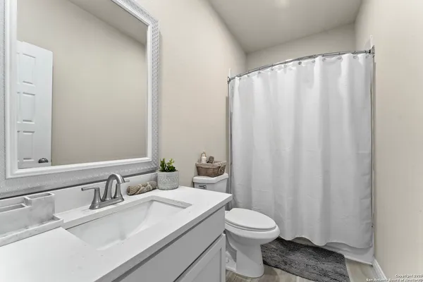 a bedroom with a bed and a television