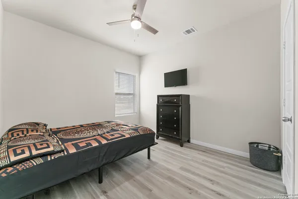 a living room with a bed furniture and a window