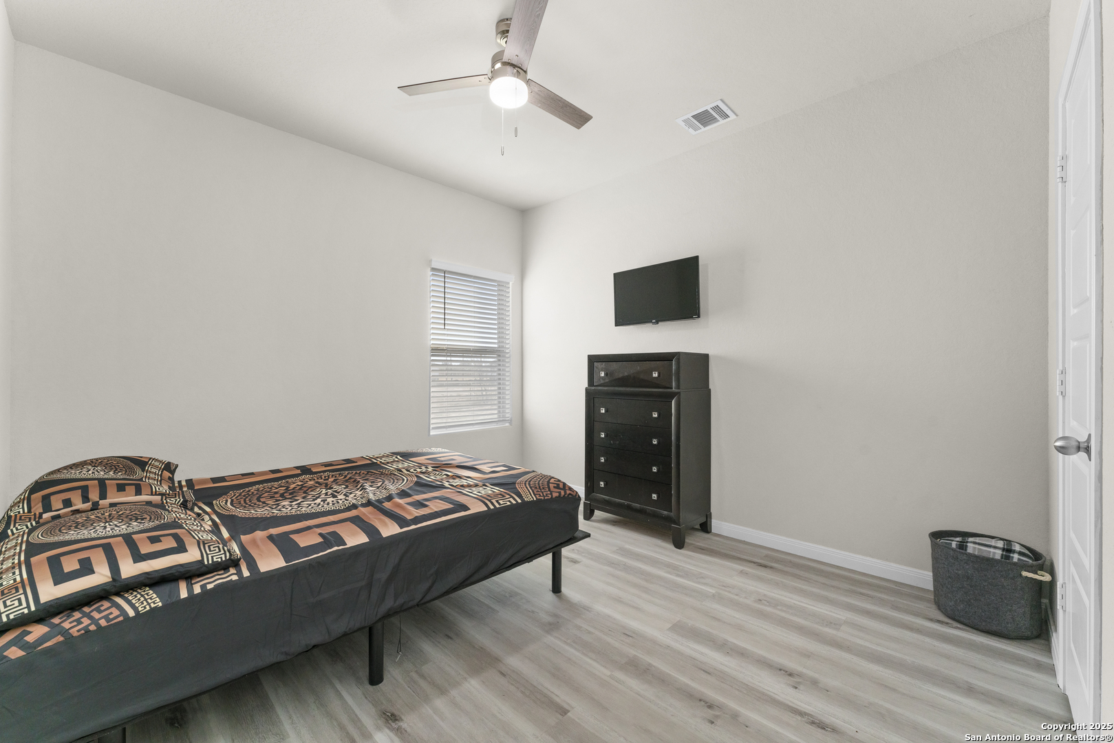 16851 Griffin Road, Unit 2 Atascosa, TX 78002 - Photo 10 of 37 a bedroom with a bed and a television