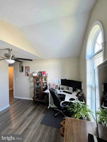 a workspace with furniture hardwood and a window