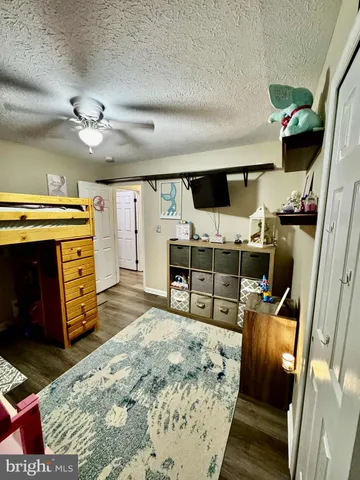 a bed room with a bed and a television