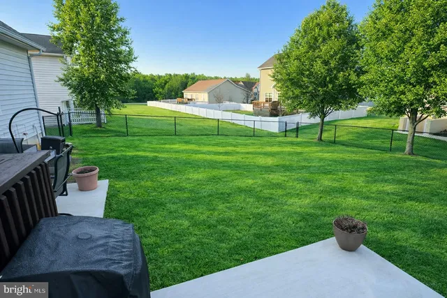 a view of a table and chairs in the garden