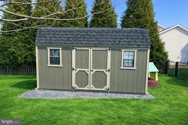 a house with garden in front of it