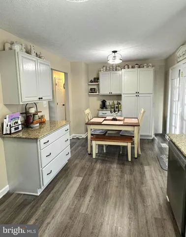 a room with a bed and a chandelier