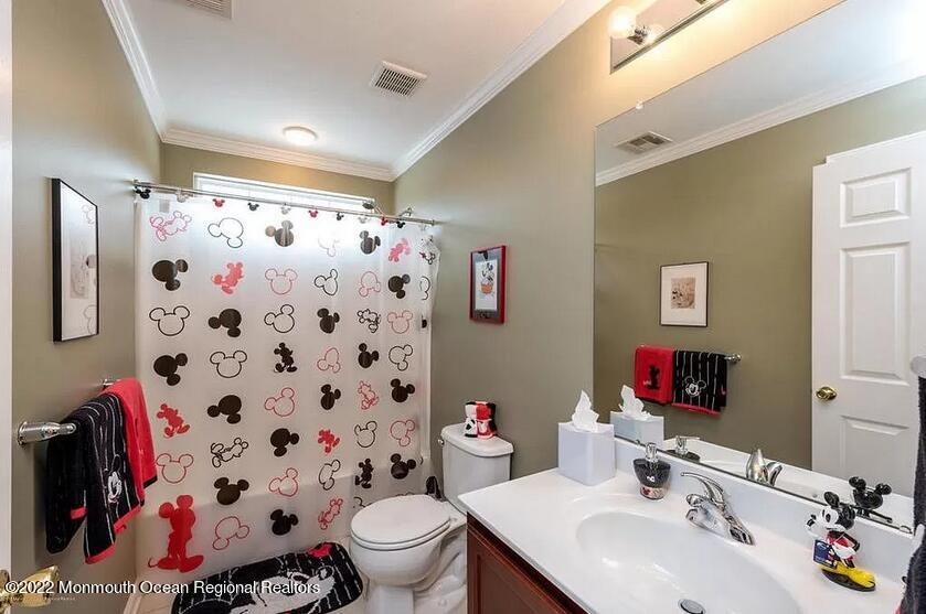 8 Firenze Road Jackson, NJ 08527 - Photo 15 of 23 a bathroom with a sink and a mirror