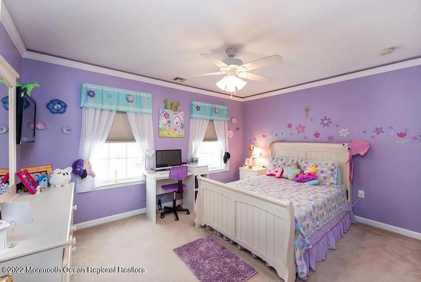 8 Firenze Road Jackson, NJ 08527 - Photo 16 of 23 a bedroom with a bed and a chandelier