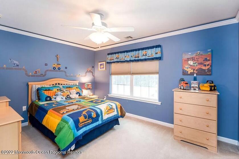 8 Firenze Road Jackson, NJ 08527 - Photo 17 of 23 a bedroom with a bed and a dresser in it