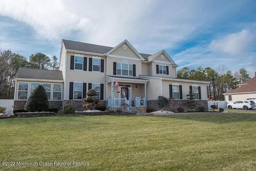 8 Firenze Road Jackson, NJ 08527 - Photo 2 of 23 a front view of a house with a yard