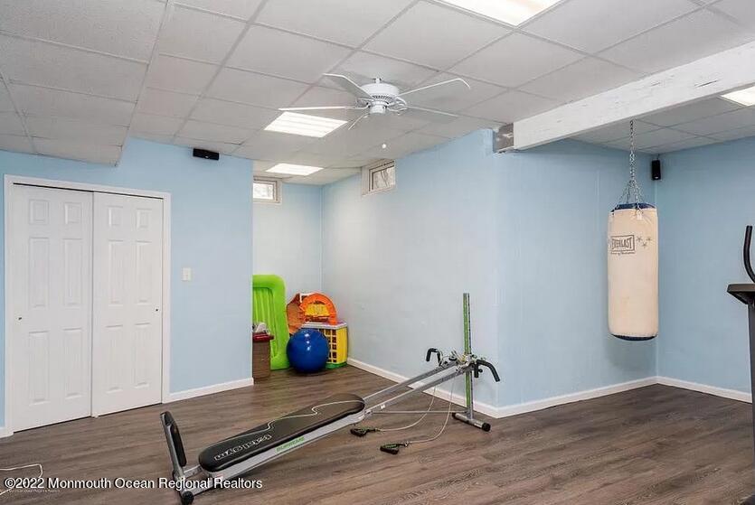 8 Firenze Road Jackson, NJ 08527 - Photo 23 of 23 a room with gym equipment and wooden floor