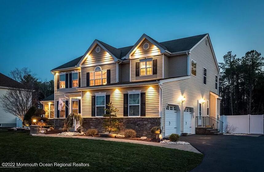 8 Firenze Road Jackson, NJ 08527 - Photo 3 of 23 a front view of a house with a yard