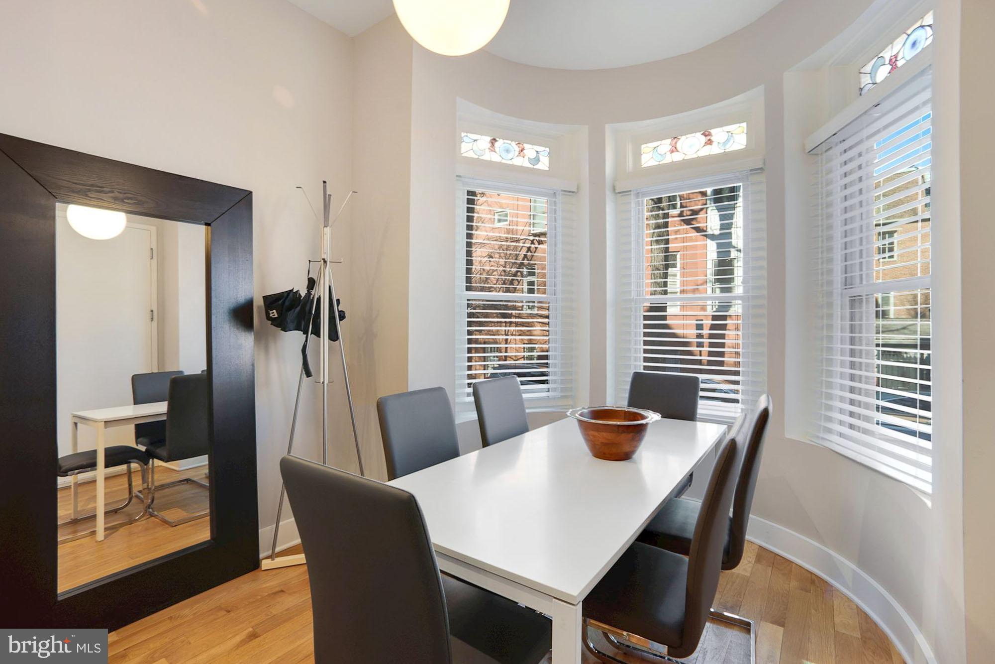 1538 Swann Street Northwest Washington, DC 20009 - Photo 17 of 37 Unit 1 - Dining Area with Stained Transom Windows