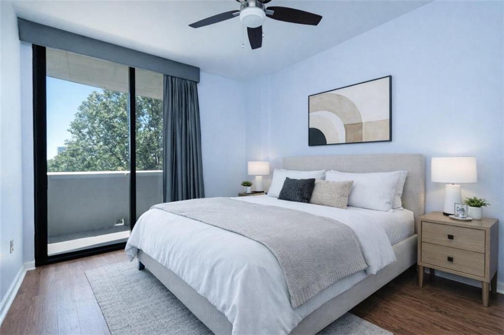 3040 Peachtree Road, Unit 507 Atlanta, GA 30305 - Photo 2 of 33 a bedroom with a large bed and a window
