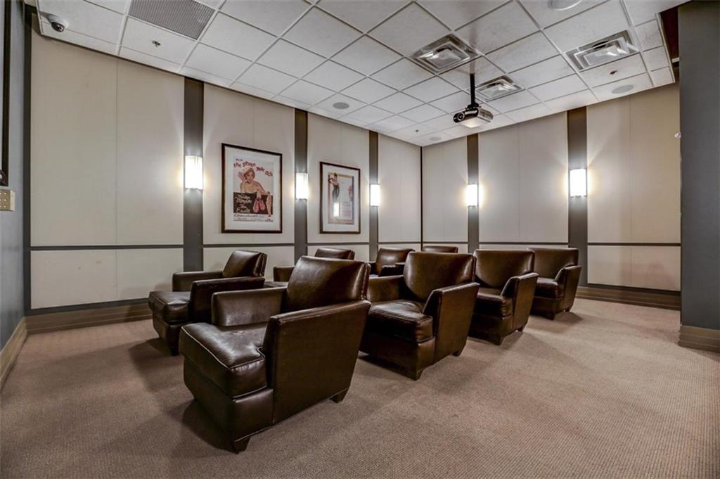 3040 Peachtree Road, Unit 507 Atlanta, GA 30305 - Photo 21 of 33 a media room with lots of chairs and mirrors