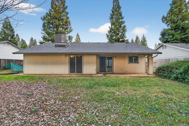 a view of a house with yard and a garden