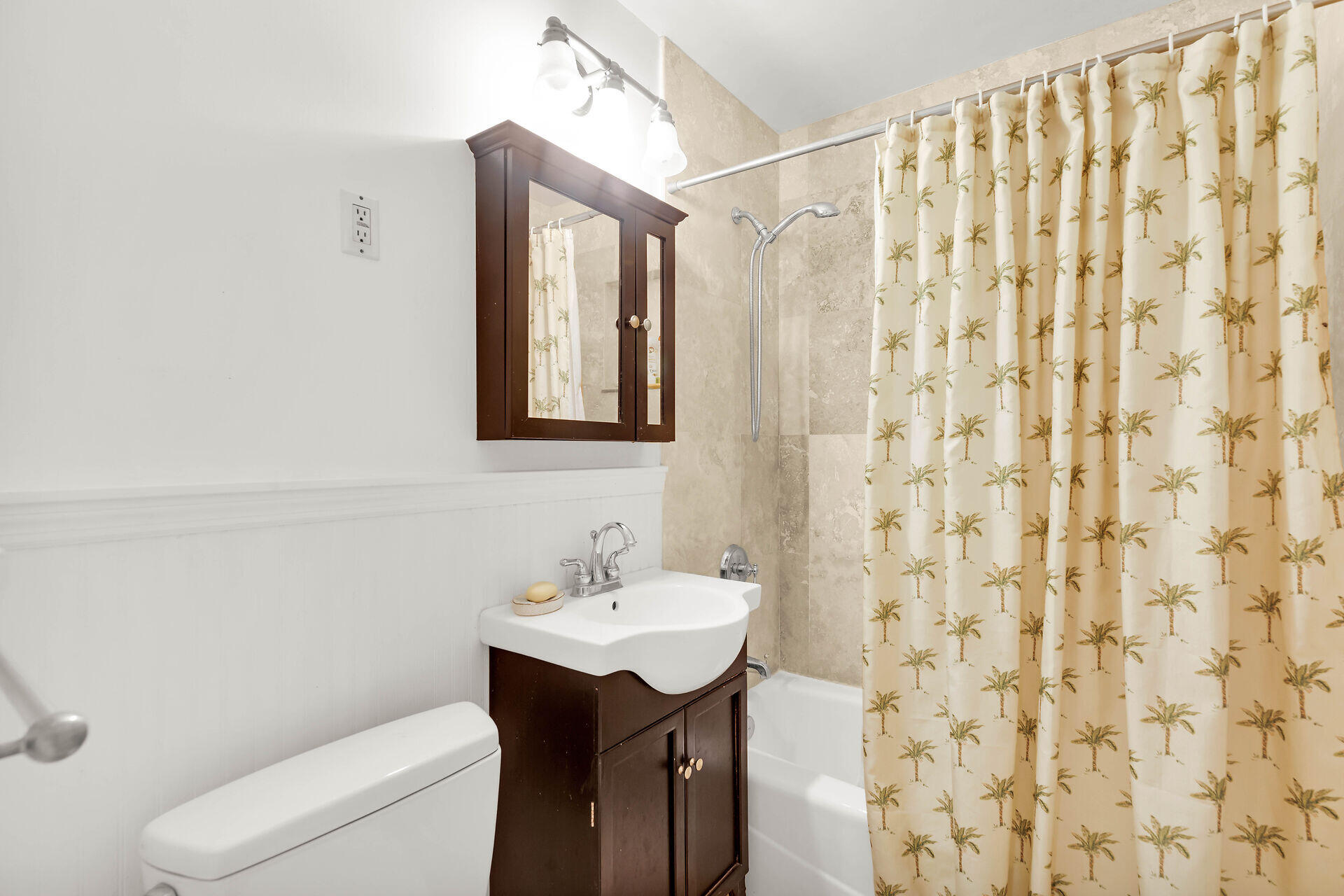 1505 Rose Street Key West, FL 33040 - Photo 30 of 55 a bathroom with a sink a toilet and shower curtain