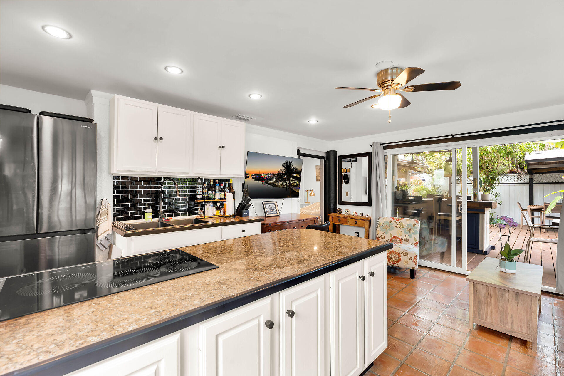 1505 Rose Street Key West, FL 33040 - Photo 45 of 55 a large kitchen with stainless steel appliances a large counter top a stove and a sink