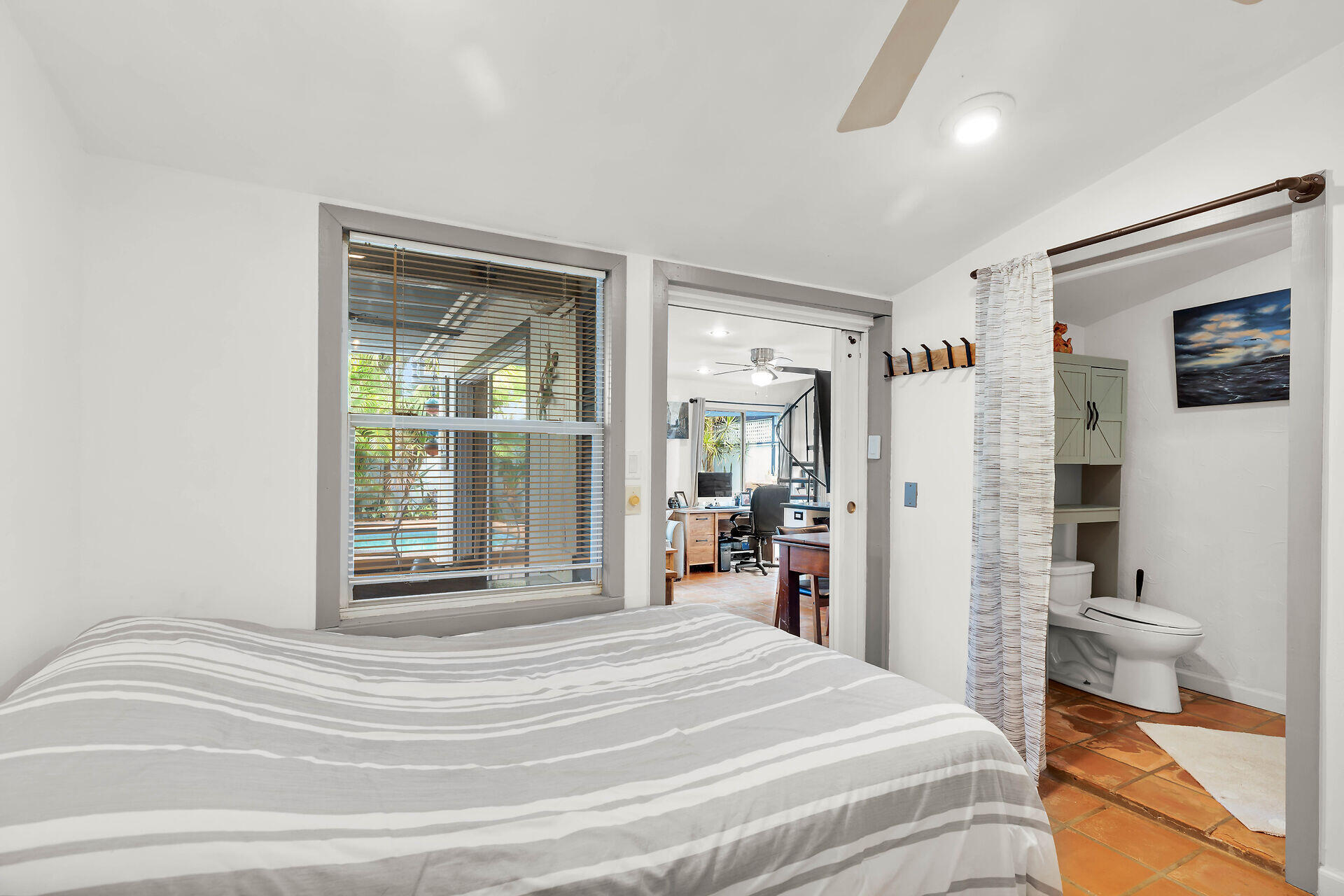 1505 Rose Street Key West, FL 33040 - Photo 55 of 55 a spacious bedroom with a bed and a large mirror