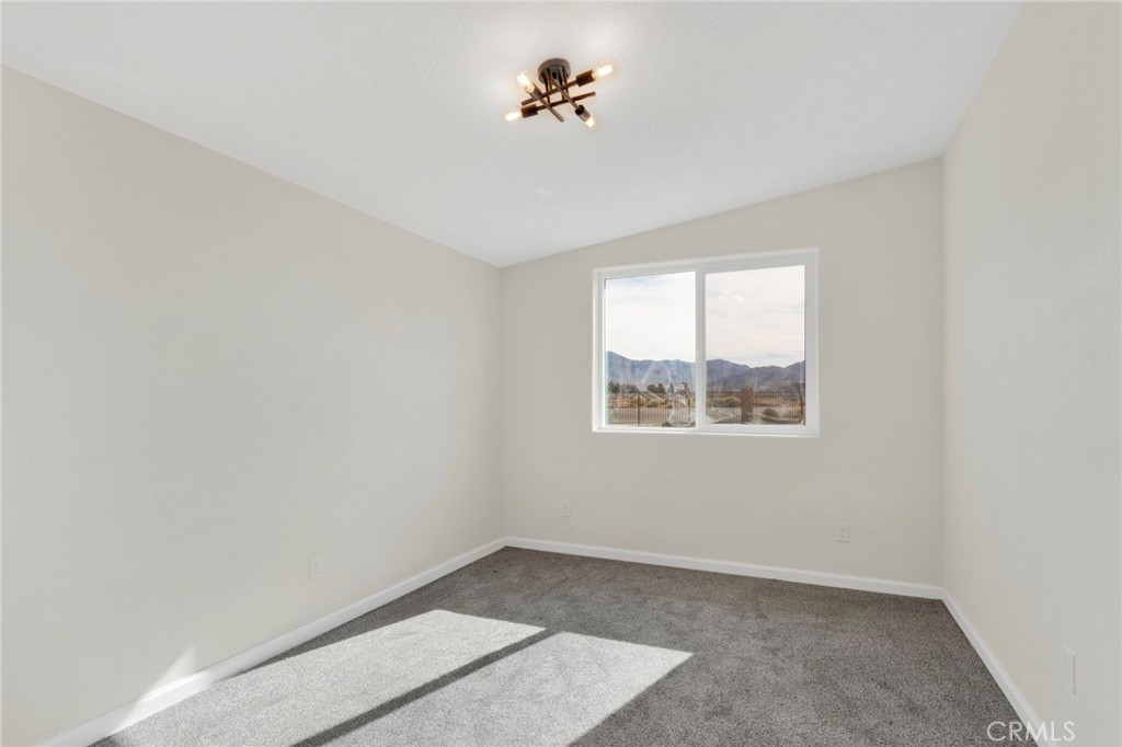 14344 Central Road Apple Valley, CA 92307 - Photo 20 of 61 an empty room with a window