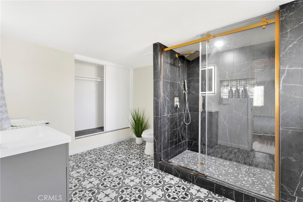 14344 Central Road Apple Valley, CA 92307 - Photo 28 of 61 a bathroom with a shower and a sink