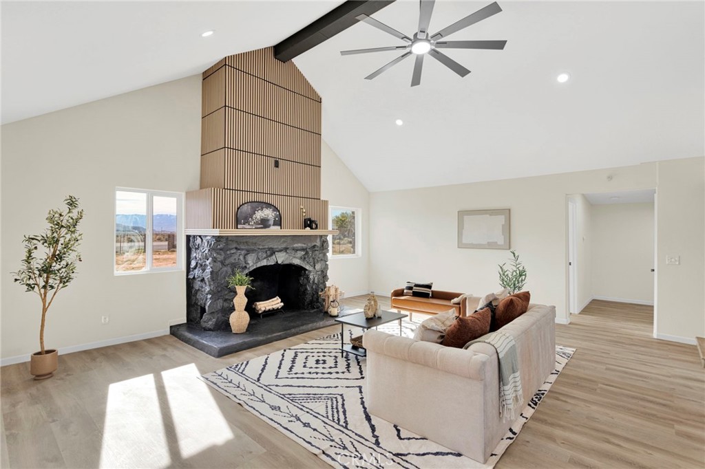 14344 Central Road Apple Valley, CA 92307 - Photo 3 of 61 a living room with furniture and a fireplace