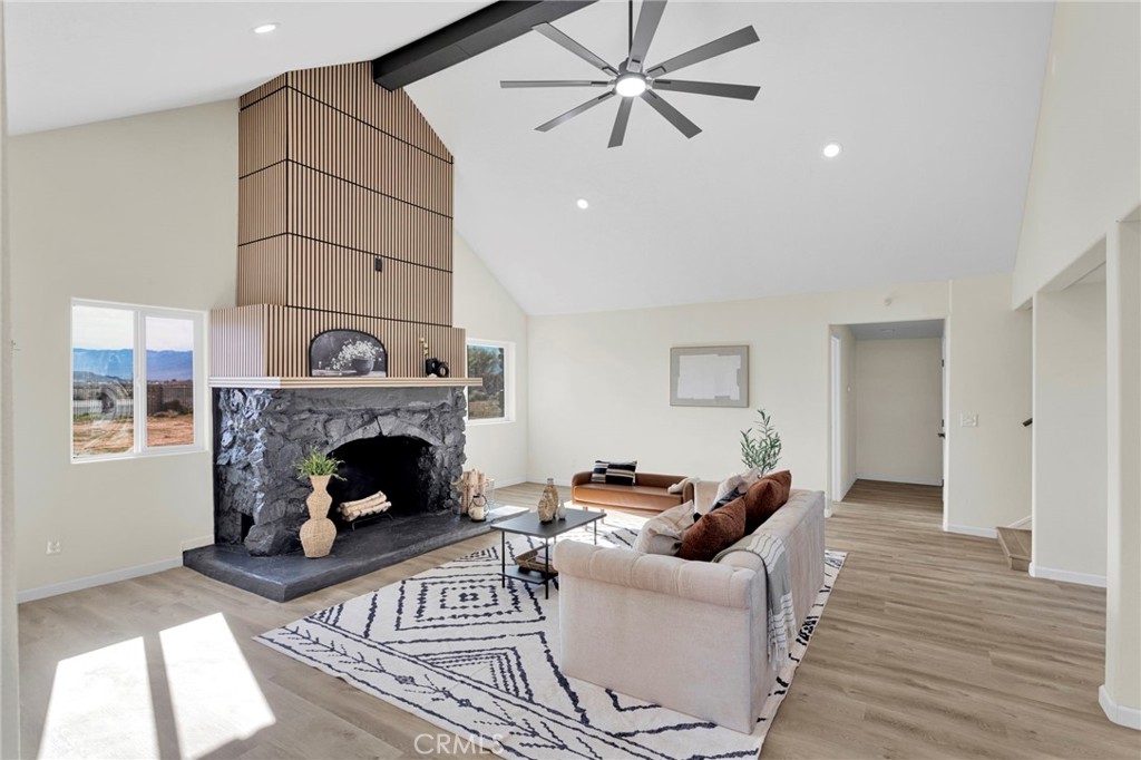 14344 Central Road Apple Valley, CA 92307 - Photo 37 of 61 a living room with furniture and a fireplace