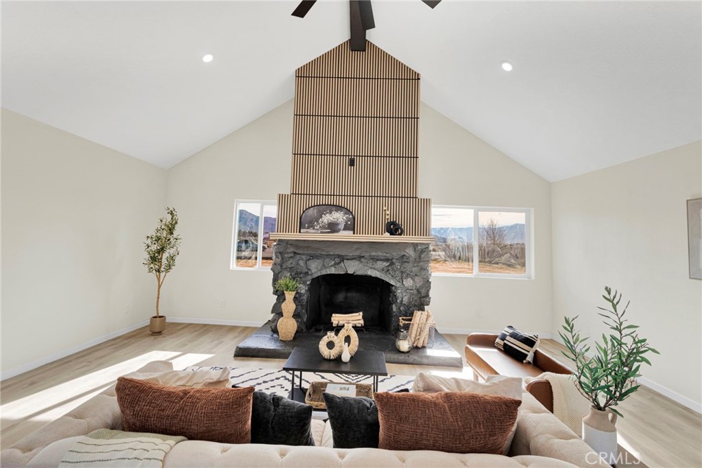 14344 Central Road Apple Valley, CA 92307 - Photo 5 of 61 a living room with furniture and a fireplace