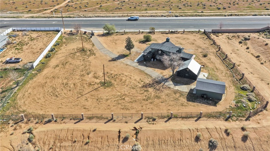 14344 Central Road Apple Valley, CA 92307 - Photo 60 of 61 a bedroom with a bed and a window