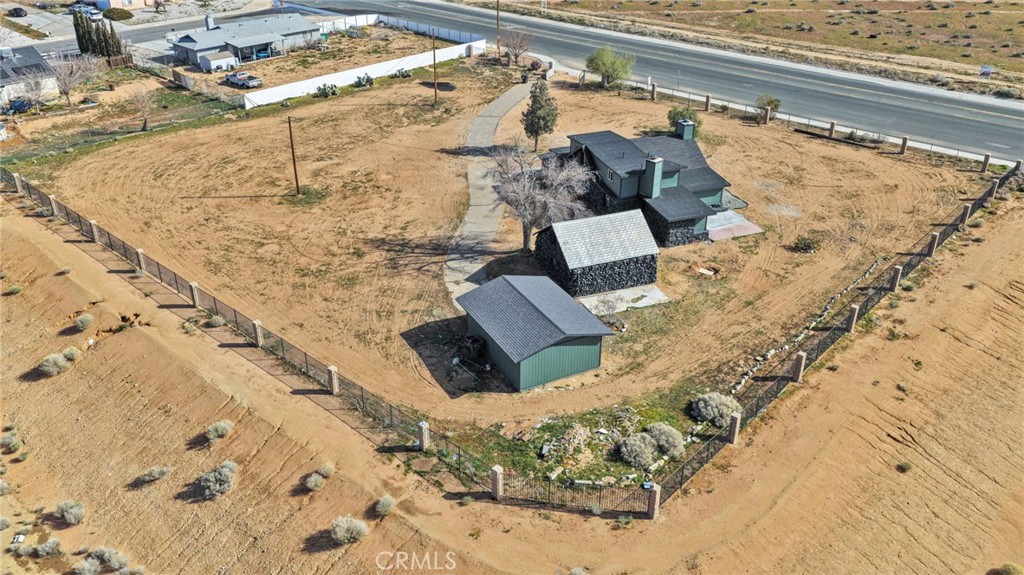 14344 Central Road Apple Valley, CA 92307 - Photo 61 of 61 a bed with a blanket and pillows