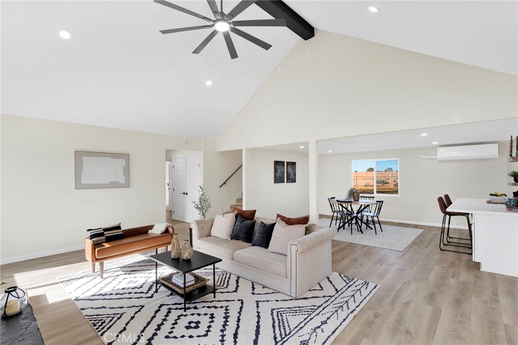14344 Central Road Apple Valley, CA 92307 - Photo 7 of 61 a living room with furniture and a wooden floor