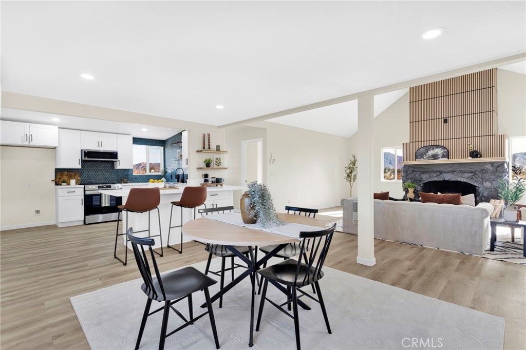 14344 Central Road Apple Valley, CA 92307 - Photo 9 of 61 a view of a dining room with furniture and wooden floor