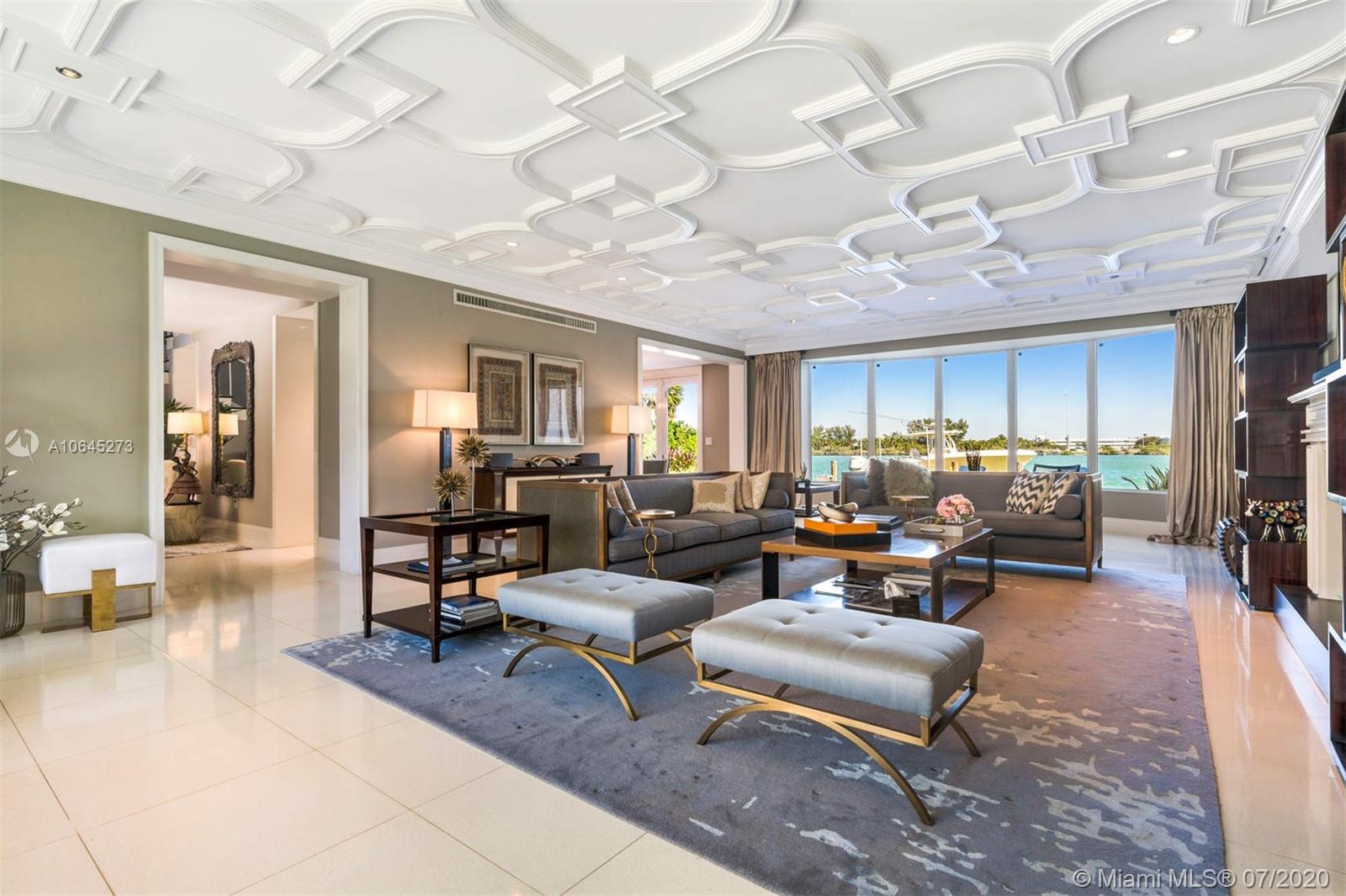 1475 North View Drive Miami Beach, FL 33140 - Photo 12 of 27 a living room with furniture kitchen view and a chandelier