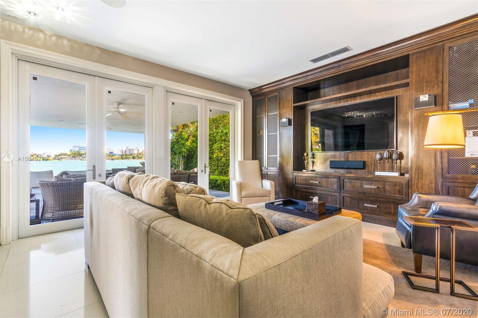 1475 North View Drive Miami Beach, FL 33140 - Photo 16 of 27 a living room with furniture and a large window