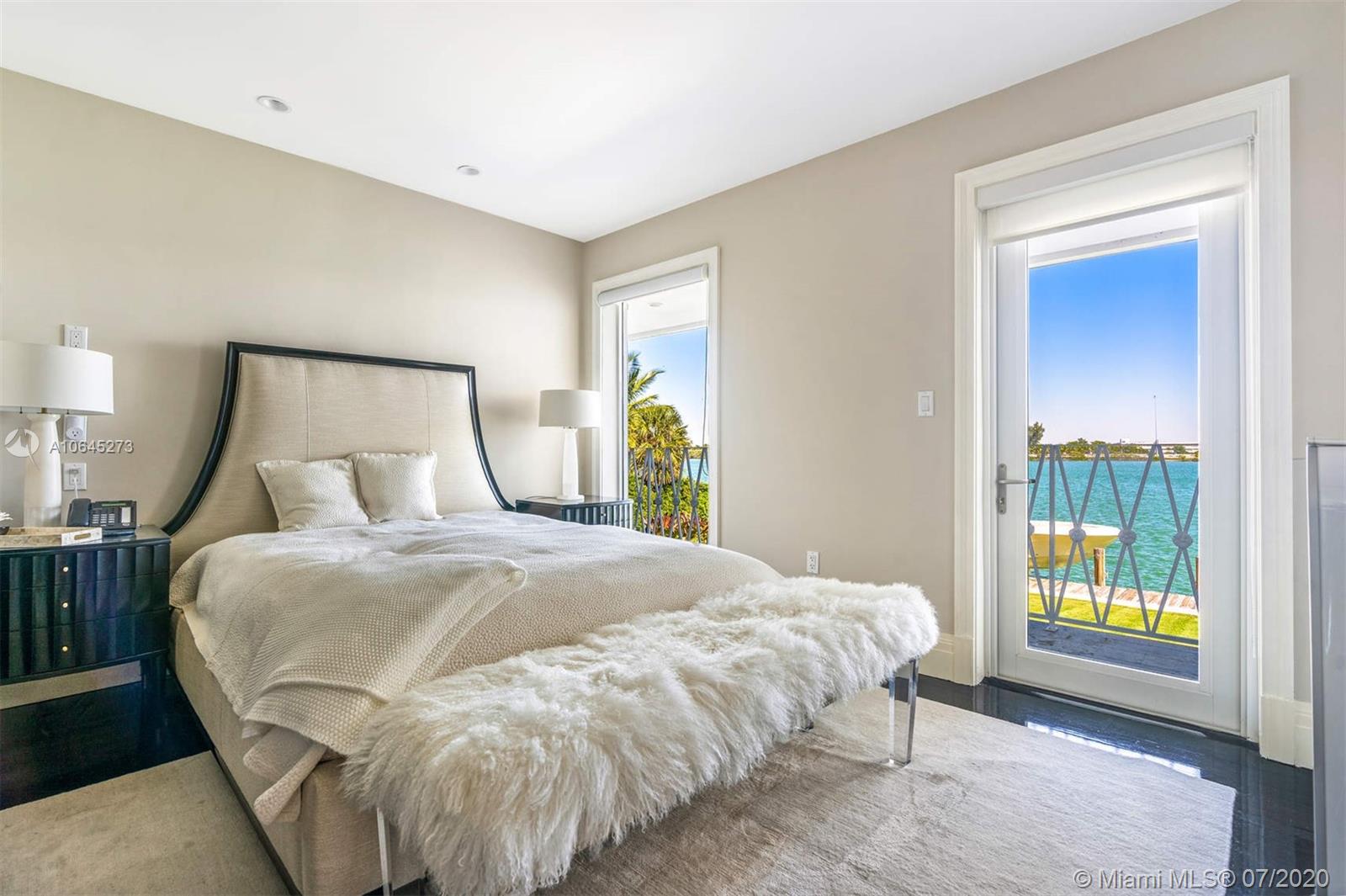 1475 North View Drive Miami Beach, FL 33140 - Photo 20 of 27 a bedroom with a bed and a window