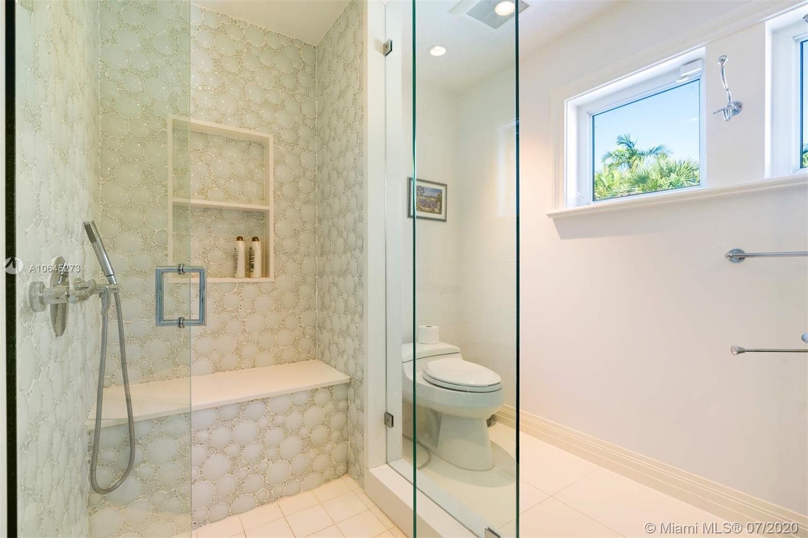 1475 North View Drive Miami Beach, FL 33140 - Photo 21 of 27 a bathroom with a granite countertop bathtub shower and toilet