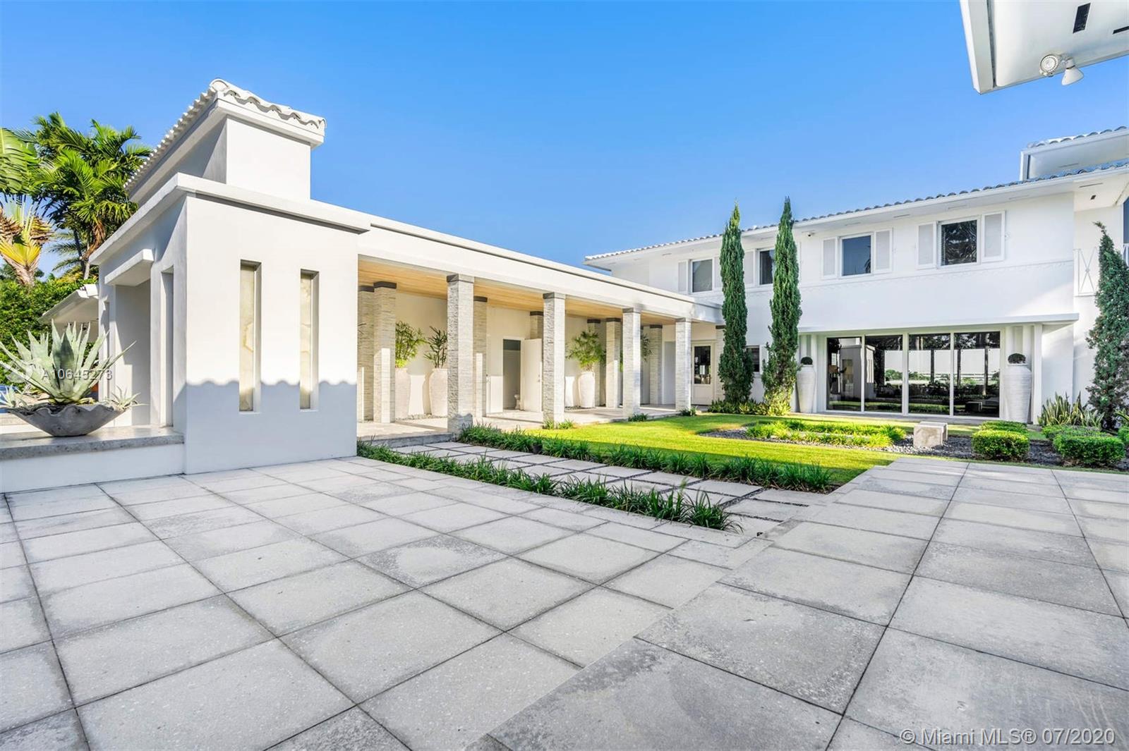 1475 North View Drive Miami Beach, FL 33140 - Photo 5 of 27 a view of a house with a swimming pool and a yard