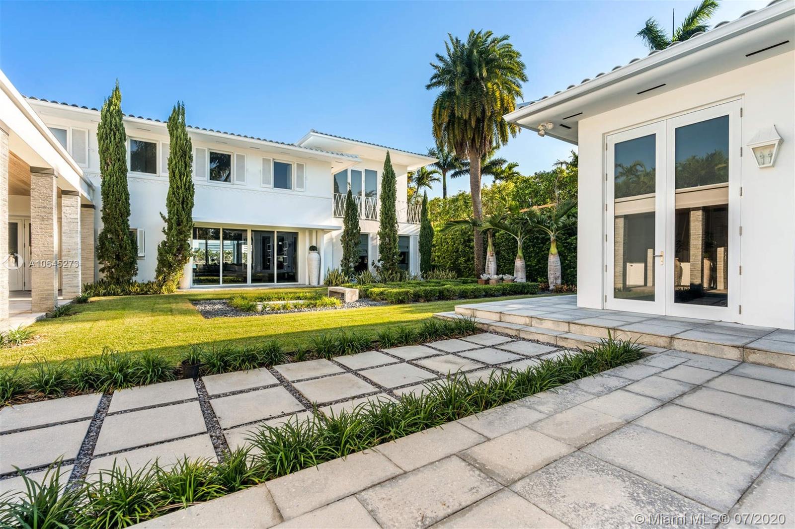 1475 North View Drive Miami Beach, FL 33140 - Photo 6 of 27 a front view of a house with a yard