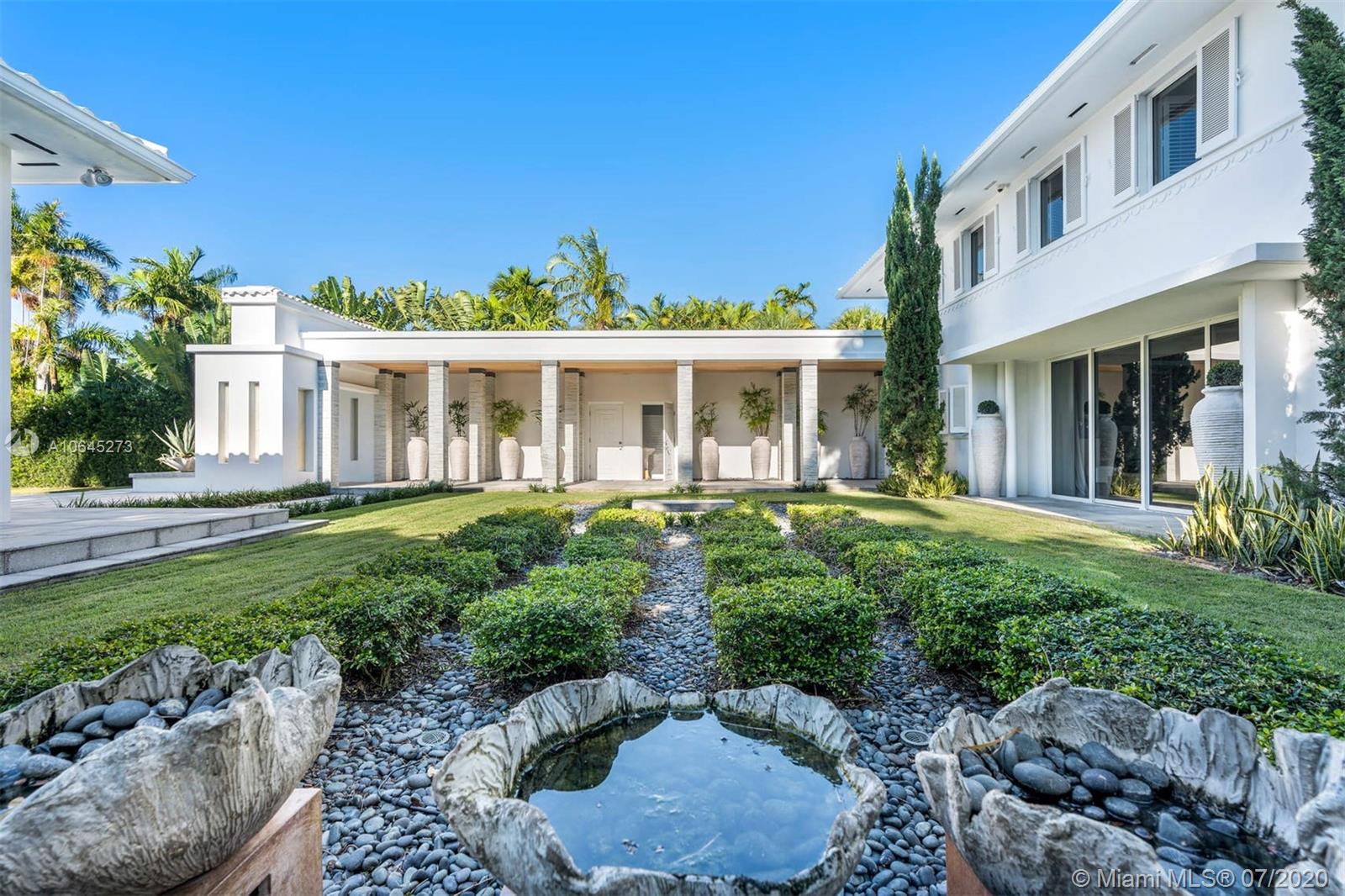 1475 North View Drive Miami Beach, FL 33140 - Photo 8 of 27 a front view of a house with a yard