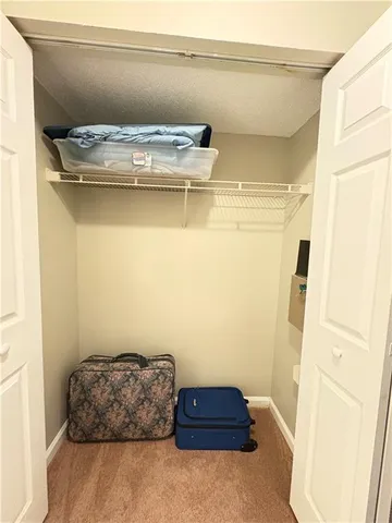 a room with a wooden floor and a cabinet
