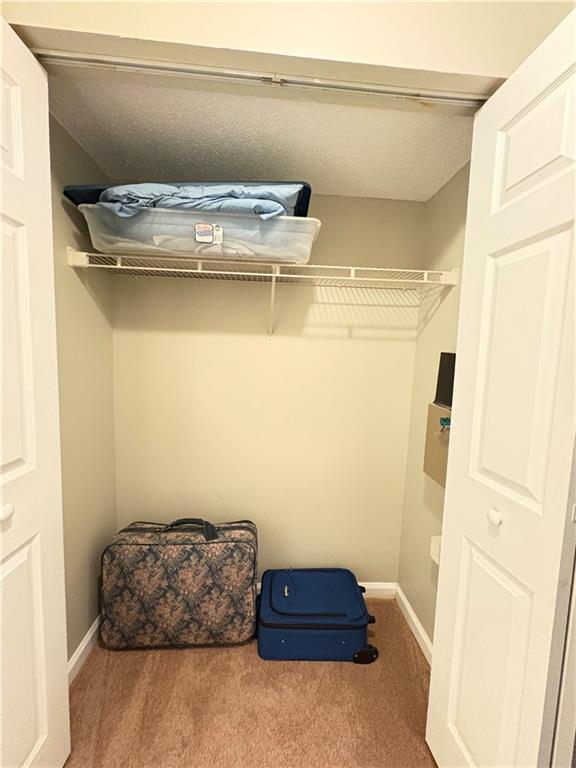 2657 Lenox Road Northeast, Unit 31 Atlanta, GA 30324 - Photo 11 of 18 a room with a wooden floor and a cabinet