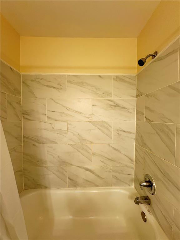 2657 Lenox Road Northeast, Unit 31 Atlanta, GA 30324 - Photo 9 of 18 a bathroom with a shower