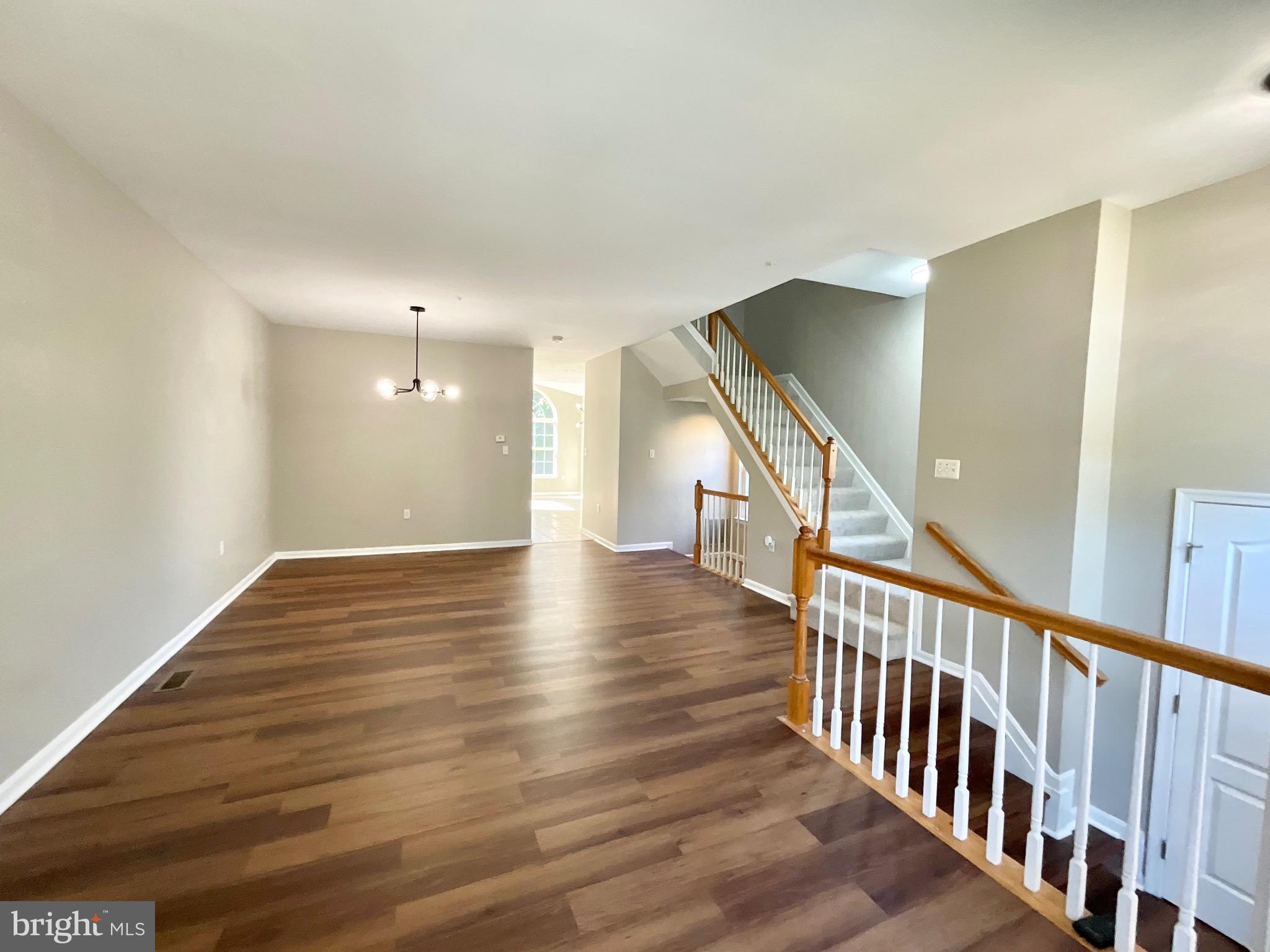 4308 Huntshire Road Randallstown, MD 21133 - Photo 13 of 40 a view of a hallway with wooden floor