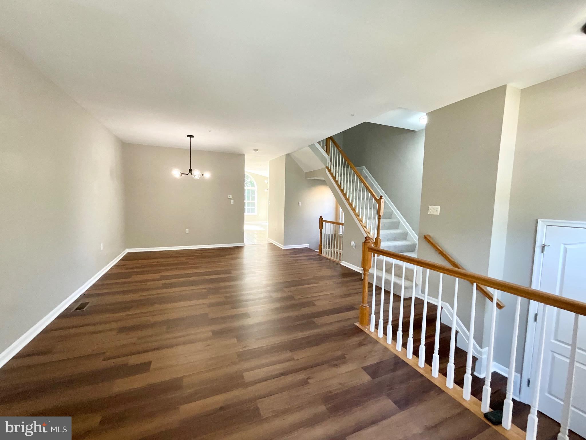 4308 Huntshire Road Randallstown, MD 21133 - Photo 14 of 40 a view of a hallway with wooden floor